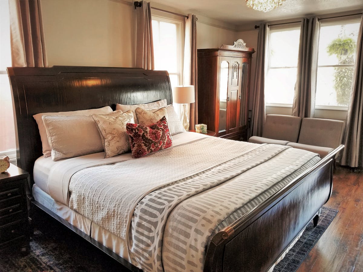 The Fitzgerald room with a king bed and antique furnishings