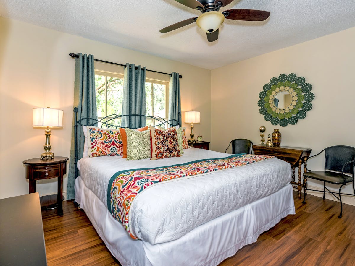 Magnolia Suite with a king bed and colorful period details