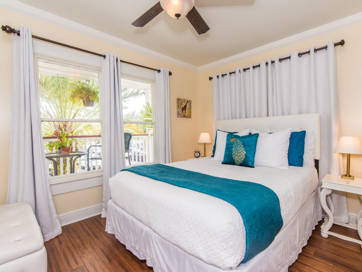 Palm South room with a queen bed and porch view